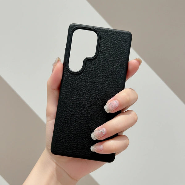 Hand holding a Samsung Lychee-Leather Texture Silicone Black Case against a neutral background