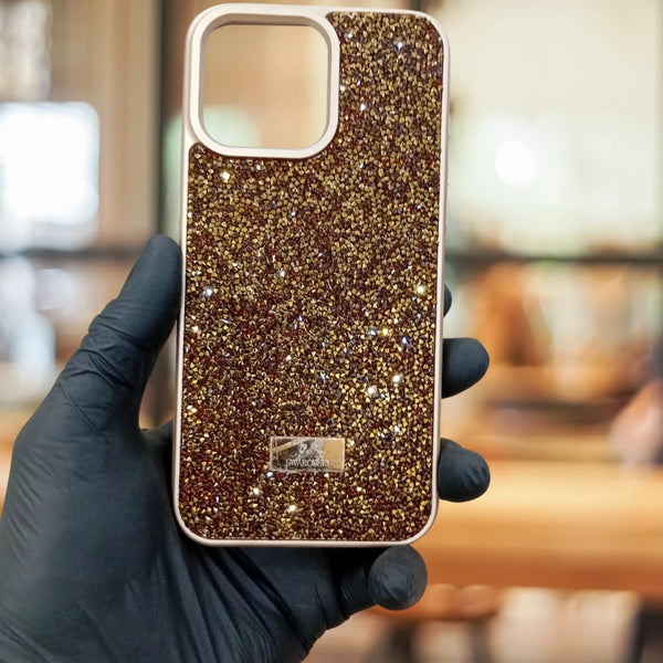Swarovski Glitter iPhone Case held by a gloved hand with a blurred background